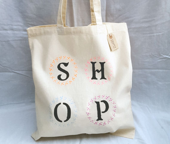 A Natural Cotton Tote Shoulder Bag with a Multi-Colour Shop Design