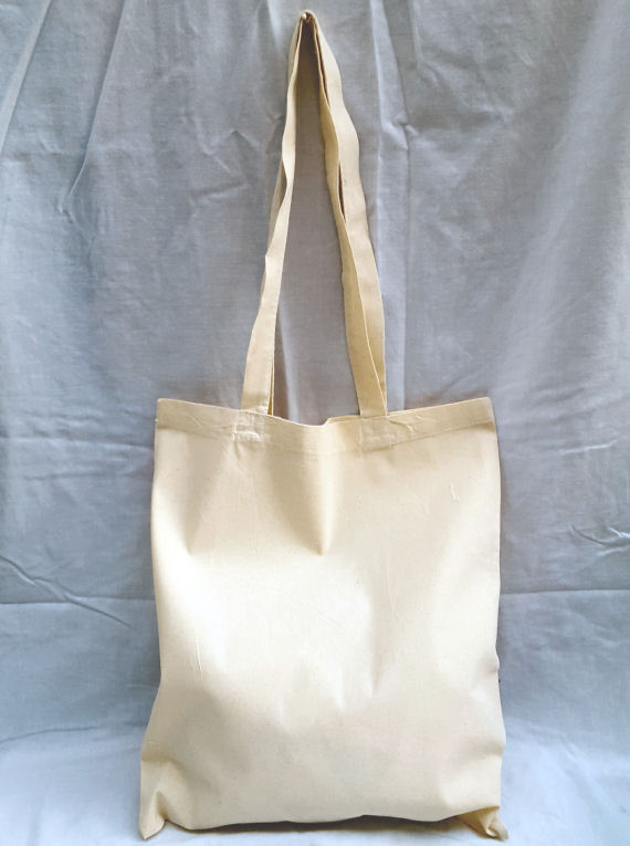 A Natural Cotton Tote Shoulder Bag with a Multi-Colour Shop Design