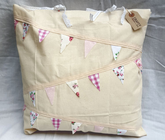 Natural Calico Cushion with a Pink Bunting Design