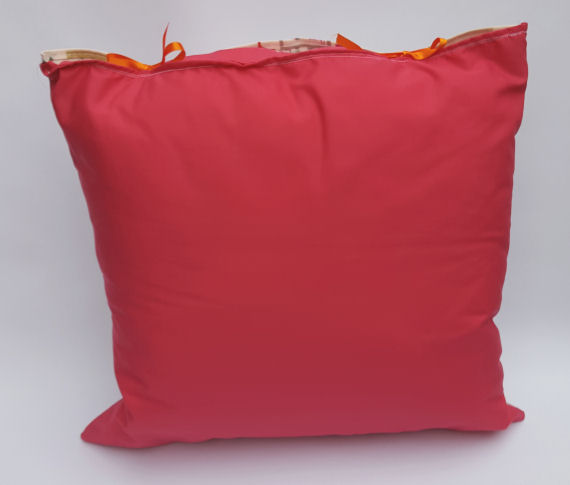 A Handmade Home Garden Design Cushion with Pink reverse and Orange Bows