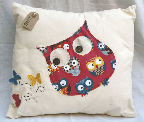 A Natural Calico Cushion with an Owl and Butterfly Design finished with an Envelope Style Reverse
