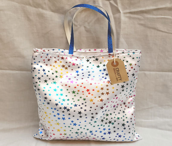 A Multi-Colour Gift Bag with Blue Glitter Handles