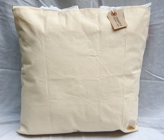 Natural Calico Cushion with a Pink Bunting Design