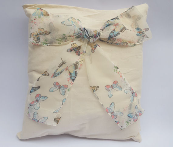 An Oblong Butterfly Bow Design Cushion