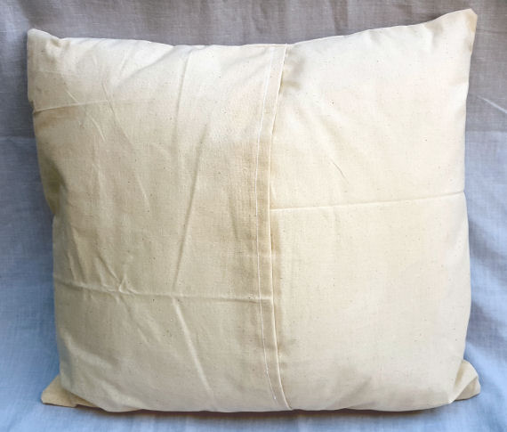A Natural Calico Cushion with an Owl and Butterfly Design finished with an Envelope Style Reverse